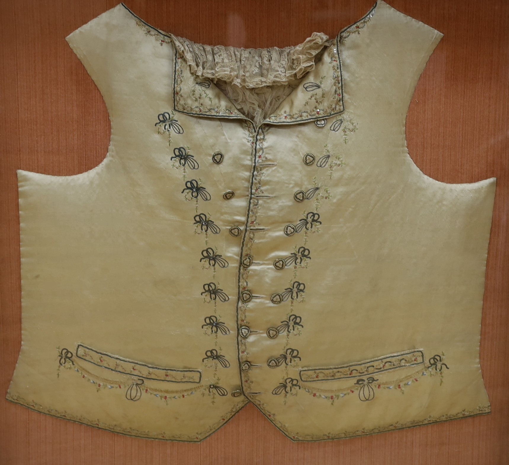 A George III silk embroidered waistcoat, reputedly once belonging to John Wilkes (1725-1797) framed and glazed